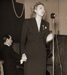 Photo: Vera Lynn sings to entertain the workers at a factory during their lunch break